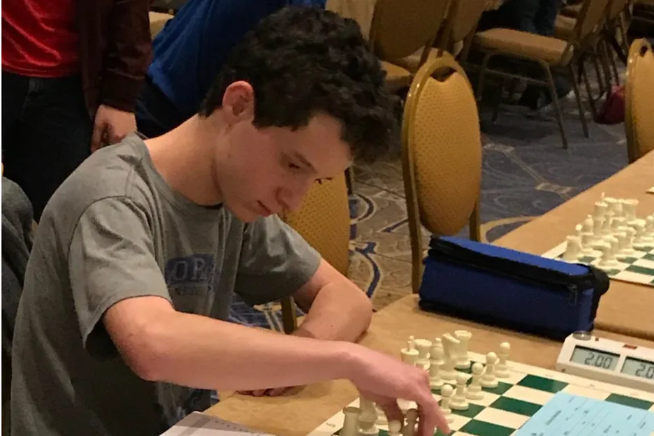 Kevin Ordet playing chess in high school (Courtesy: The Lightning Strike)