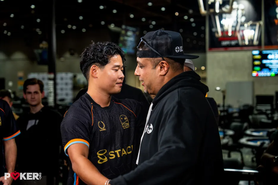 Chang congratulates his heads-up opponent, Anil Jivani.