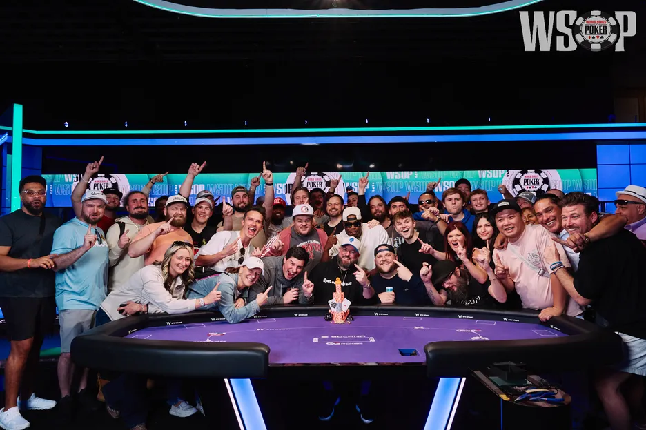 The wide angle lens was needed to get everyone into Higgins' winners photo.                              