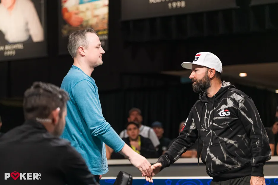 Negreanu shakes hands with the champ after the fall card. 