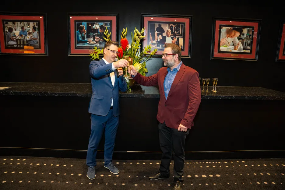 PH GM Ken Ostempowski and Jack Effel toast to the new room as famed actor Leslie Nielsen looks on. 