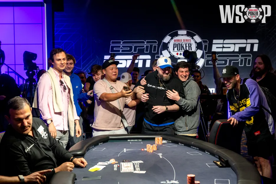 Matthew Higgins was mobbed as soon as the final card fell.