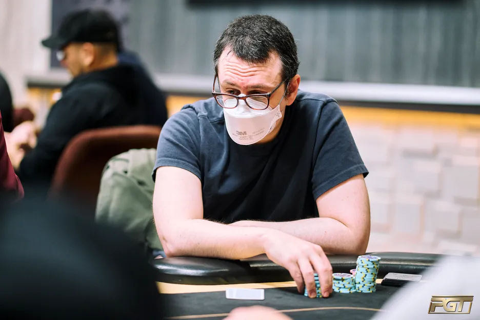 Ike Haxton tangles with Jeremy Ausmus early on in the PGT Championship $1M freeroll.