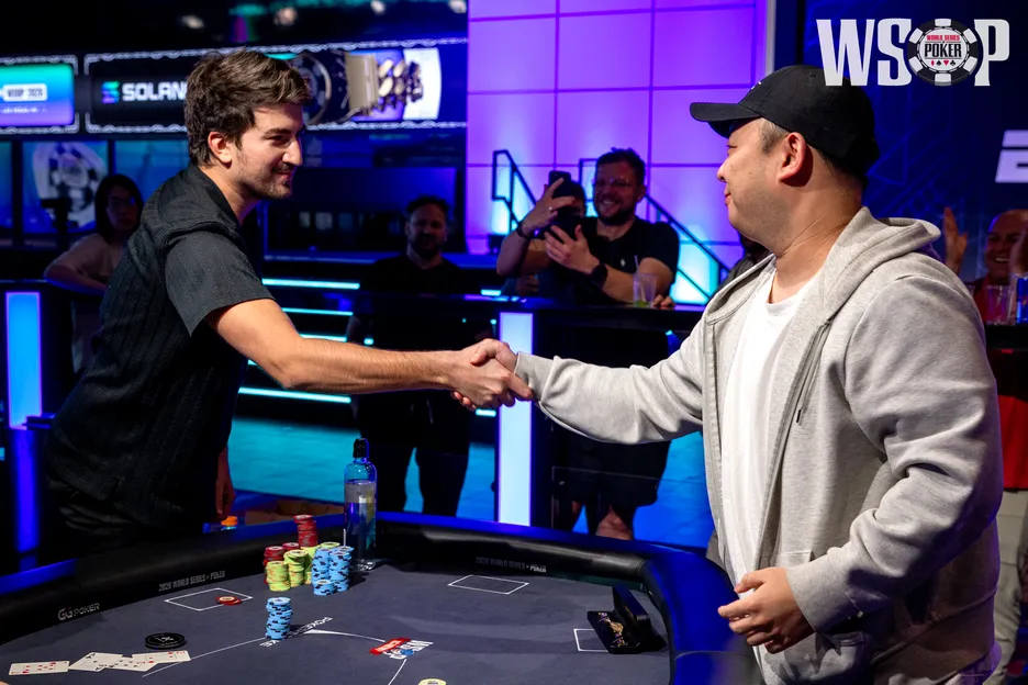 Urbanovich shakes hands with runner-up Richard Bai.
