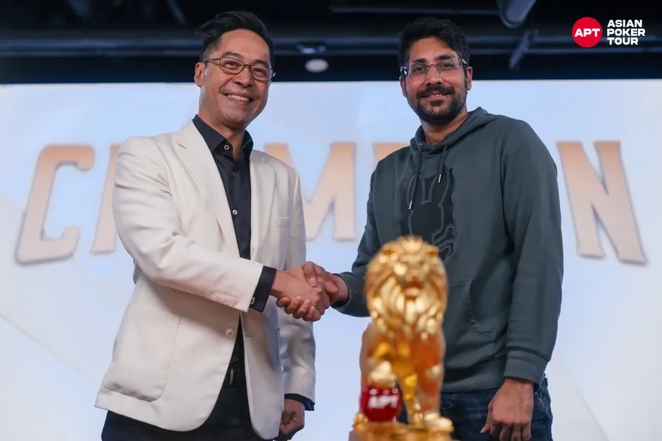 Fred Leung, left, congratulates Main Event winner Nishant Sharma.