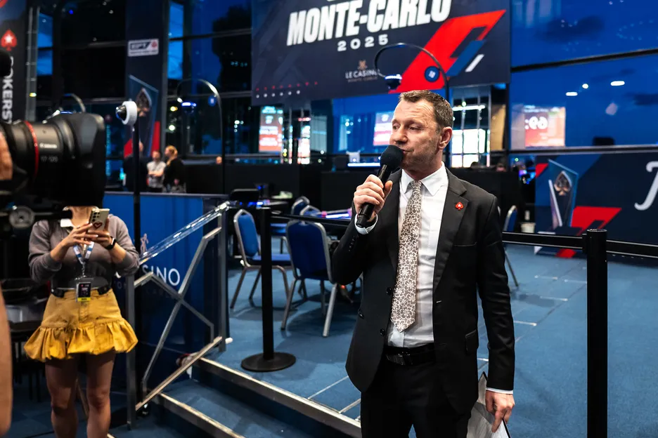 At work while others play: Toby Stone addresses the main tournament room in Monte Carlo.