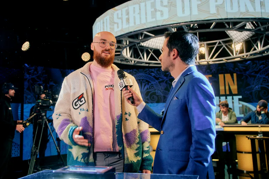 Brandon Sheils talking with the WSOP's Jeff Platt after his elimination in 8th. 
