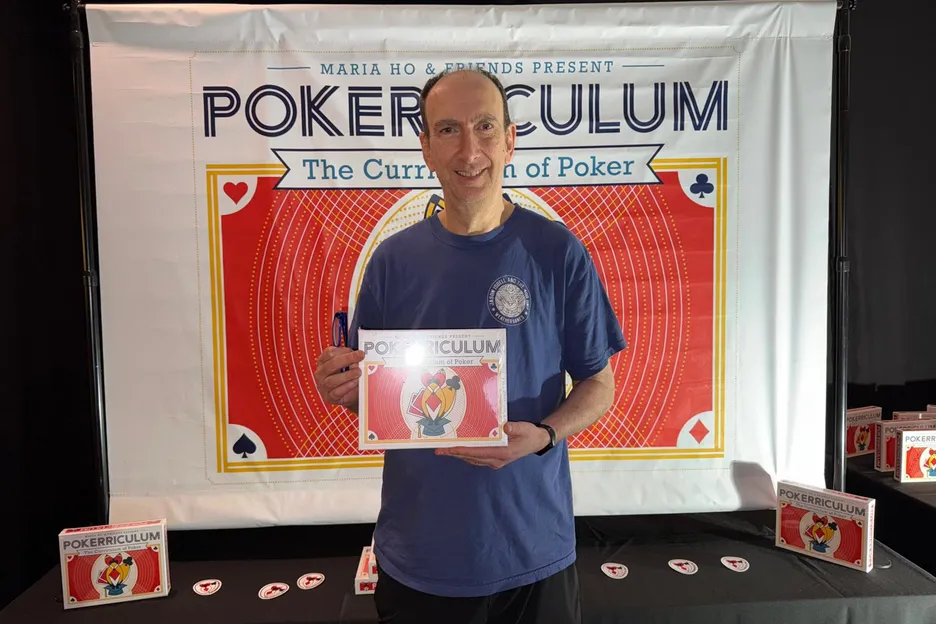 Erik Seidel stopped by the booth to sign a copy of the game.