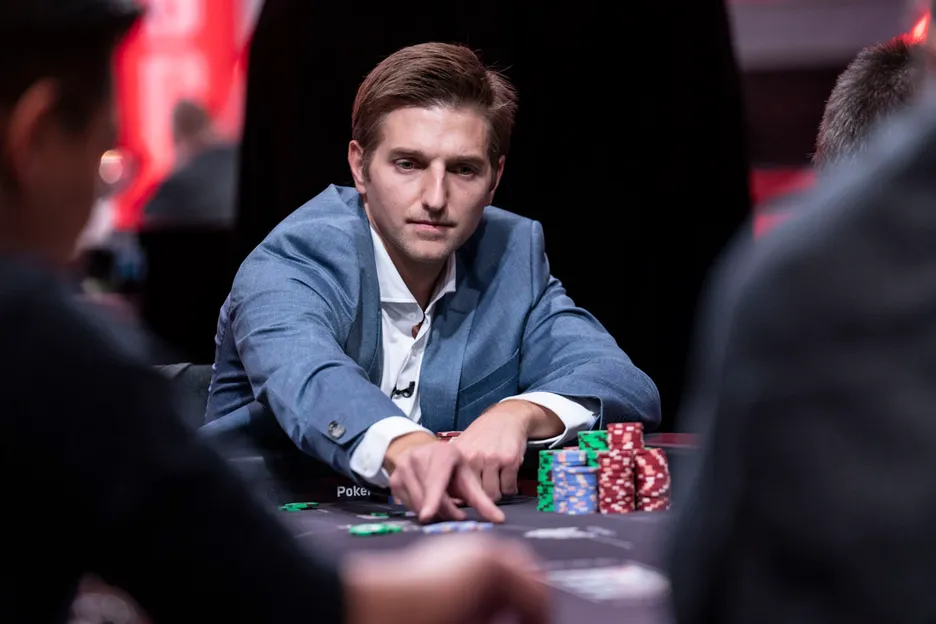 A suited Tony Dunst plays poker, by Jamie Thomson