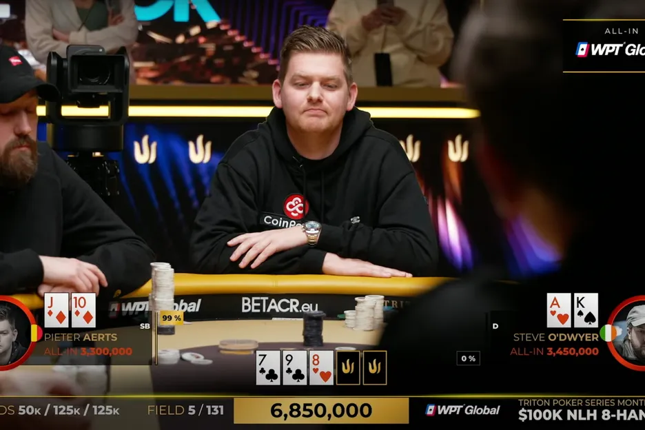Steve O'Dwyer (left) and Pieter Aerts (right) react to the flop in a key all-in confrontation. 