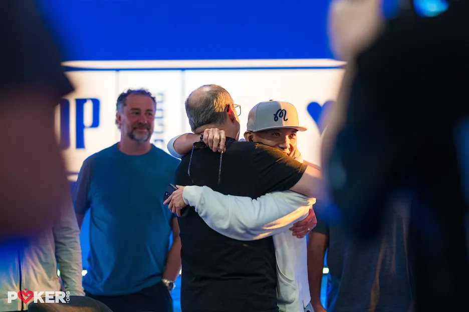 Baker receives an embrace following his win