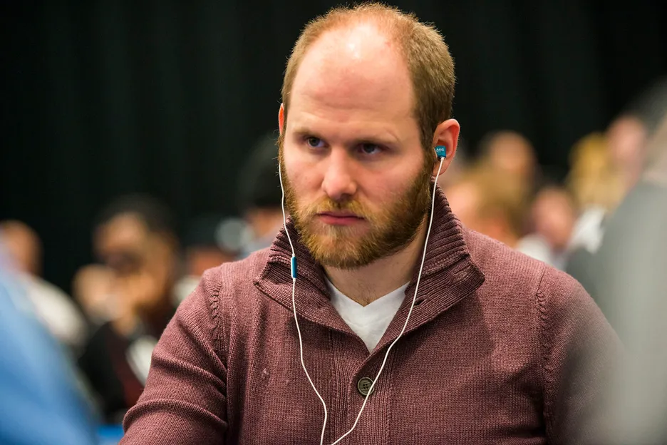 Sam Greenwood playing poker in earphones