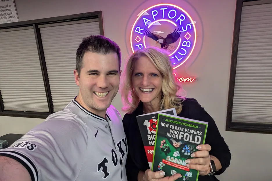 Alex Fitzgerald gives away two of his best-selling books at a home game.