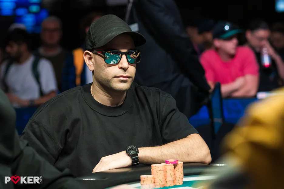 John Ishak moved all-in and had his cards mucked by the dealer. 