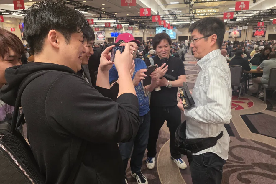 Kihara showing off his new hardware to his friends.